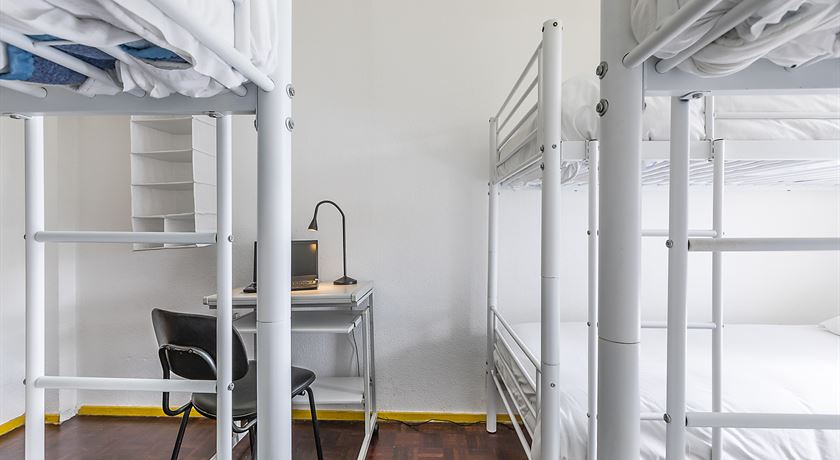 Bed in a 14-bed male dorm