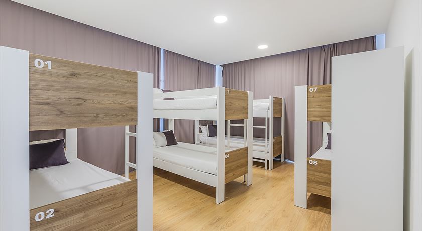 Bed in an 8-bed female dorm